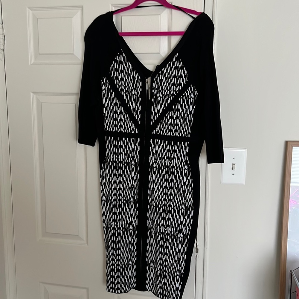 Plus size body con dress with front zipper.